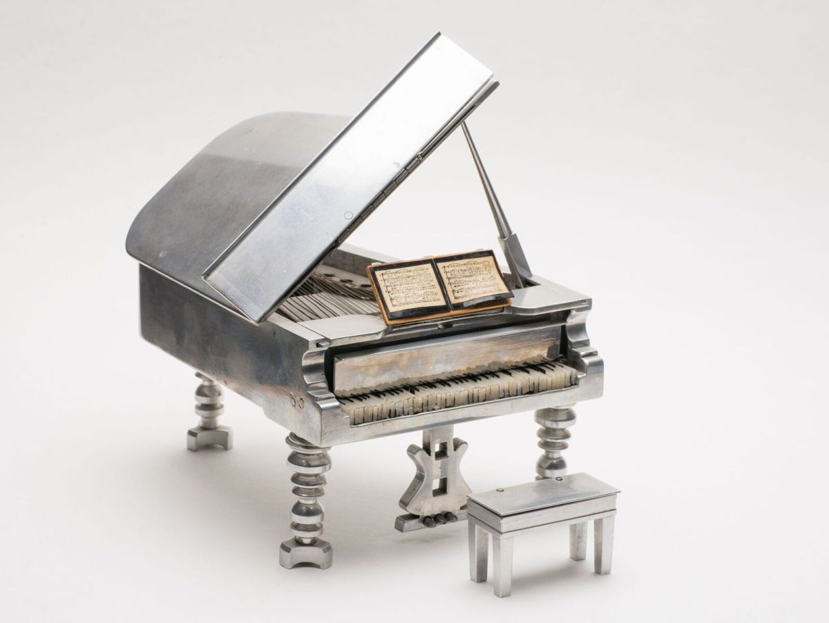 Miniature Grand Piano Abraham's miniature aluminum grand piano music box.