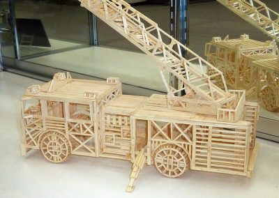 The matchstick model NYFD truck is 14” long.