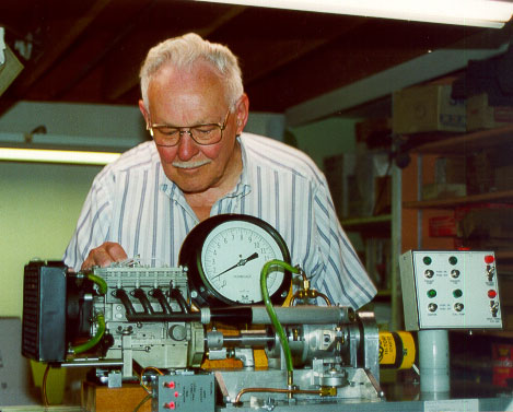 Lee With His Root Special Engine Lee is pictured testing his dual overhead cam, 4-cylinder engine on a dyno.