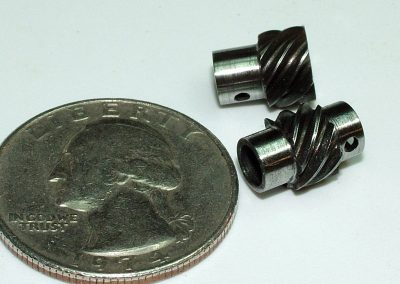 A close-up of the two finished gears after heat treating, which gave them a darker color.