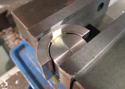 The blade is now curved after tightening the vise.