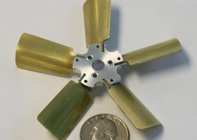 The blades were glued and pinned into slots on the fan hub.