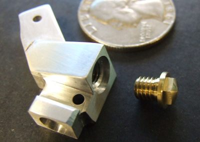 The aluminum oil galley with its brass plug.