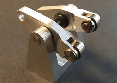 The rocker arms with pins and ball bearings installed.