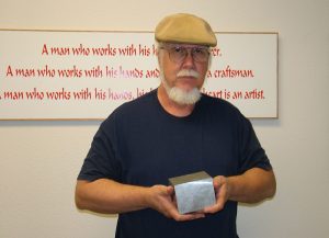 Tom With the V-4 Billet Tom holds the billet of aluminum that would become the engine block.