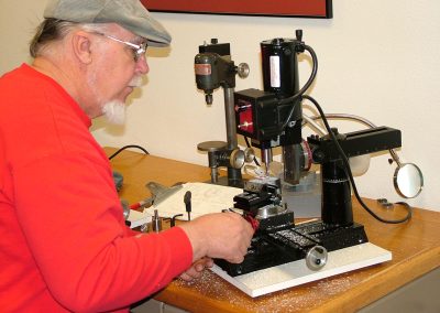 Tom Boyer machines a round boss on the distributor drive housing.