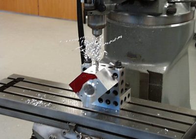 The cylinder holes on the first side are drilled to make a clearance hole for the boring tool.