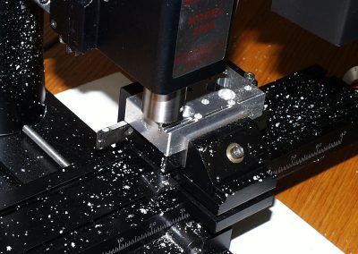 A small end mill was used on the Sherline mill to cut cooling slots.