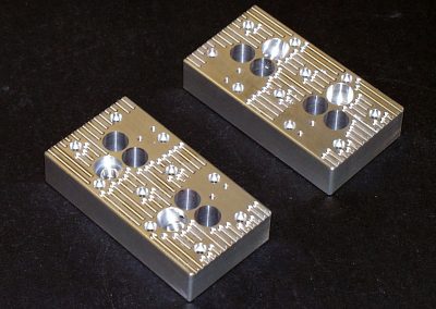 The two heads with cooling slots cut out.
