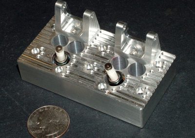 One of the heads is shown here with rocker arm brackets and spark plugs installed.