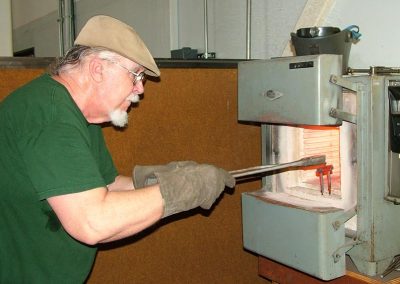 The heated fixture is brought out of the oven.