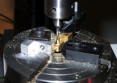 The body of the brass oil pump inlet elbow was milled to 1/8” OD using the rotary table.