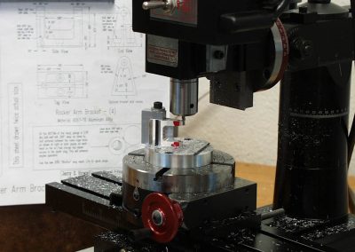 The mill was set up to cut the radius on the end of the rocker arm brackets.