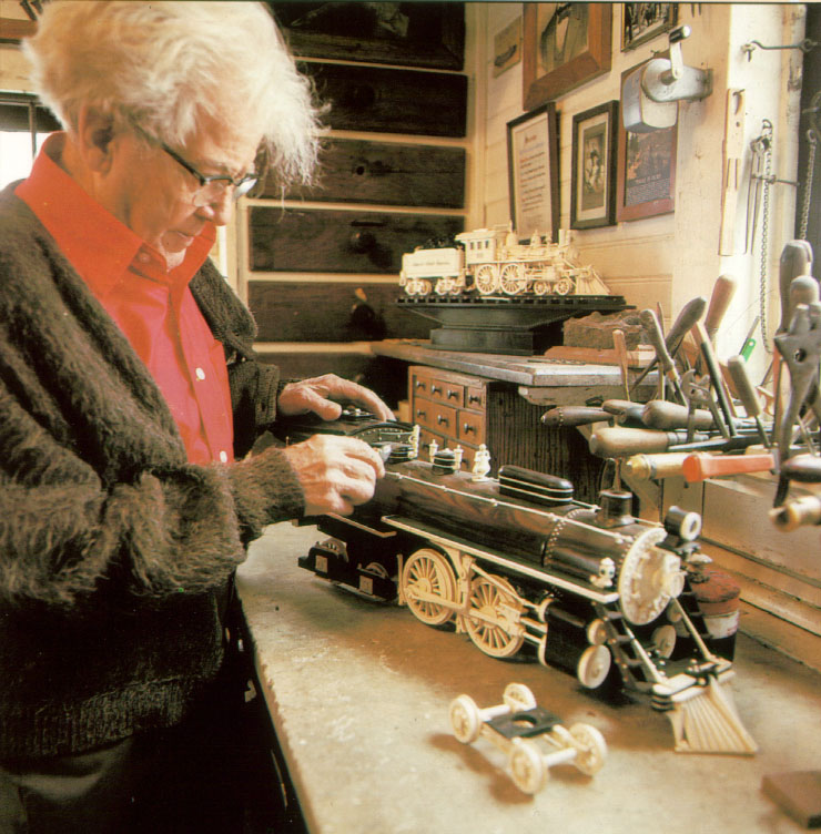 Mooney Warther at Work Mooney Warther at work on one of his locomotive carvings.