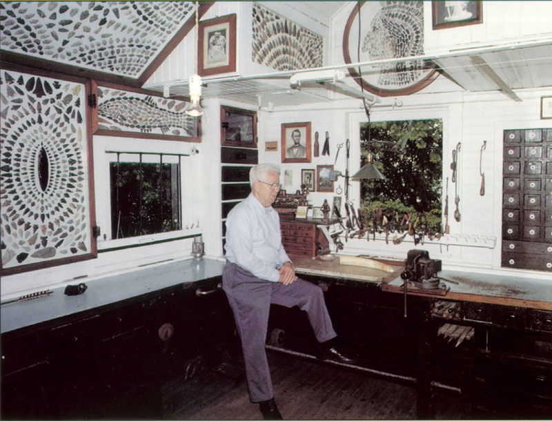 Mooney’s Workshop Mooney's son, Dave Warther, sits in the workshop.