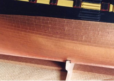 A close-up of the copper plates and rivets on the hull.