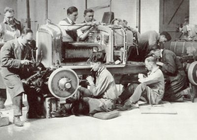 A full-size Bentley being assembled in the shop.