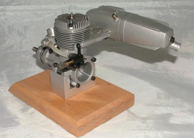 The O.S. MAX-46AX 2-cycle engine.