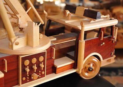 A close-up shows some of the instruments and controls on the side of the engine.