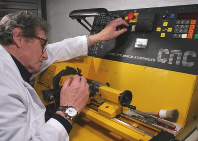 Hartwig programs and runs the CNC lathe.