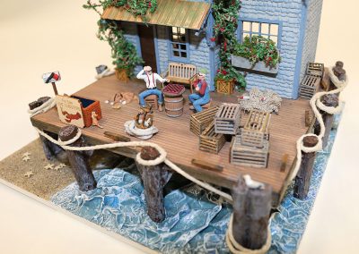 Jeannie Napolitano built this miniature, “Sea Shanty” at a scale of 1/4”:1’.