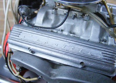 The intake and exhaust manifolds on the miniature Chevy.