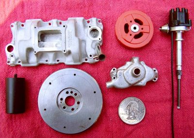 Shown here are the intake manifold, flywheel, water pump, pulley, and distributor.
