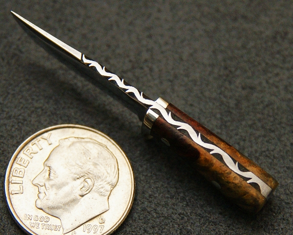 Miniature Fixed Blade Knife An overhead view of a different fixed knife.