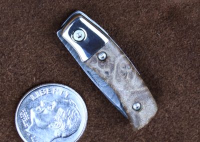 A custom miniature folding knife made by Brian Jacobson.