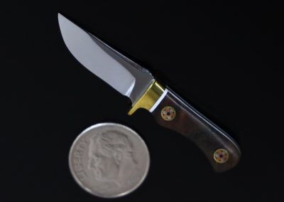 A custom miniature fixed blade knife made by Brian Jacobson.