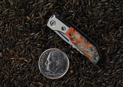 A custom miniature folding knife made by Brian Jacobson.