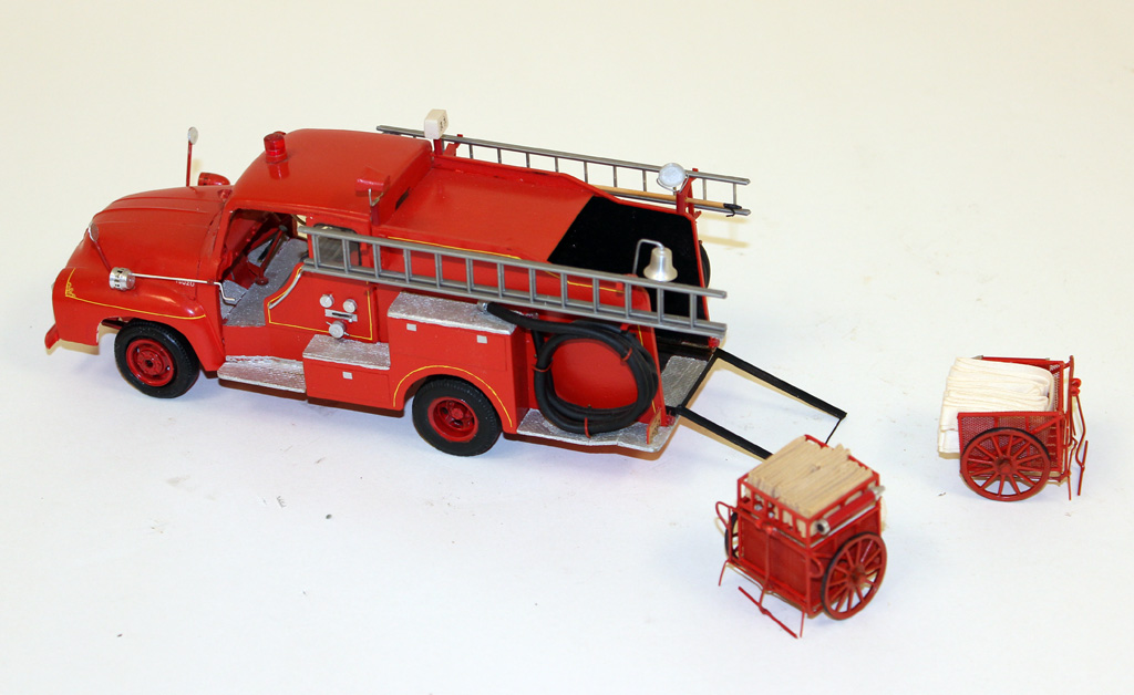 A 1/32 scale Isuzu-Morita hose cart truck.