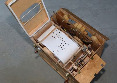 The sheet roll can be seen inside of the box organ here.