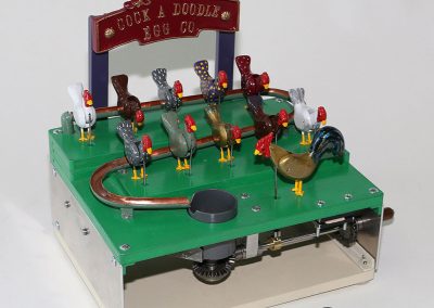 This animated farm scene is activated by turning a handle on the right side.