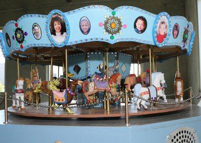 Birk's model is personalized with photos of his whole family around the outside of the upper facade.