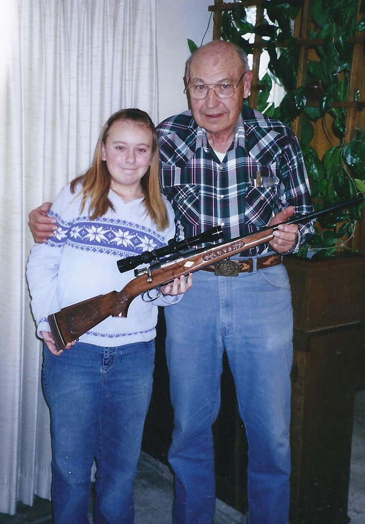Birk With His Granddaughter Birk presenting a rifle to one of his granddaughters.