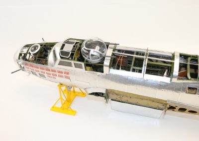 An overhead view shows some of the finished interior of the fuselage.