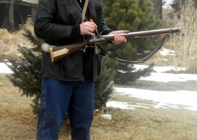 Clayton loading up his Baker rifle for firing.