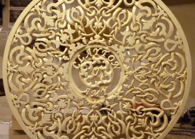 A carved wooden ornament made by Clayton.