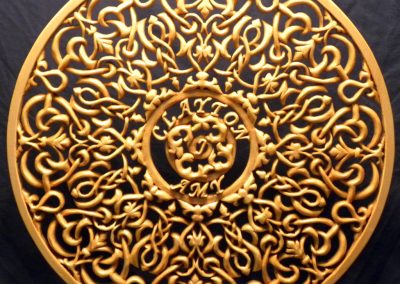 A carved wooden ornament made by Clayton.