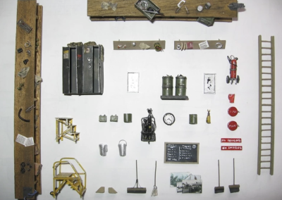 Many of the scale model items for the hangar scene are laid out here.