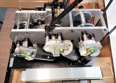 The three hoist drive motors on the left side of the model crane.