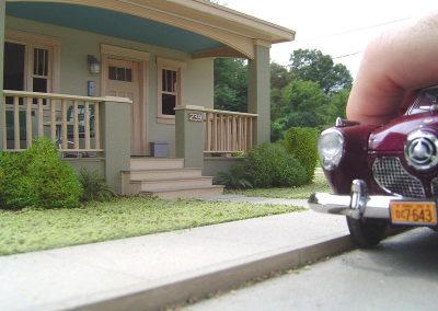 Another angle of the Bungalow with a Studebaker out front.