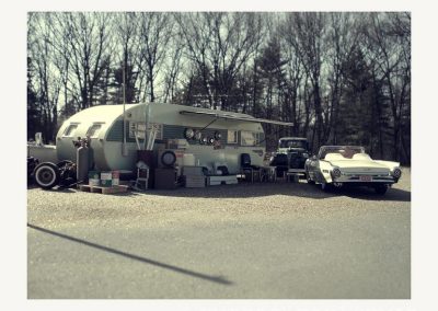 The scale model trailer is parked outside.