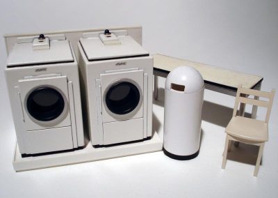 Scale model laundry machines for a tiny laundromat.