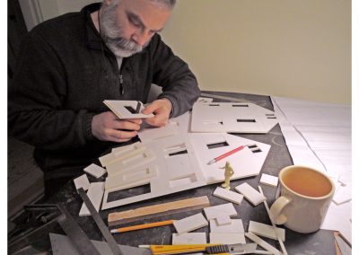 Michael cutting out window and door frames.