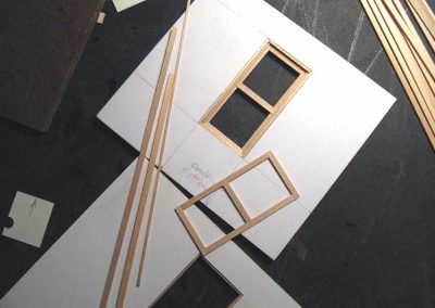 Cutting walls for the scale model house.