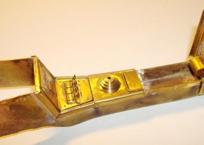 The brass center console piece.