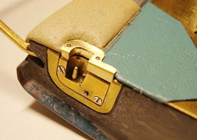 A close-up shows the unique Studebaker conical pin door locking mechanism.