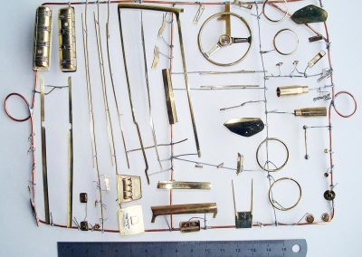 An array of brass parts ready for chroming.